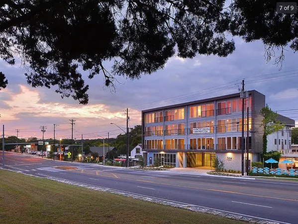 a view of a swimming pool with outdoor seating