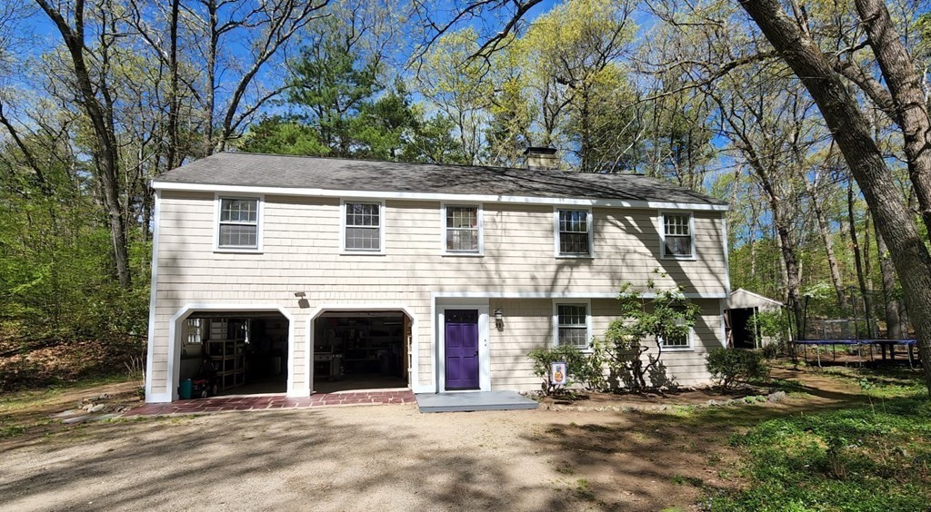 21 Stage Coach Road Boxford, MA 01921 - Photo 1 of 40 a front view of a house with a yard