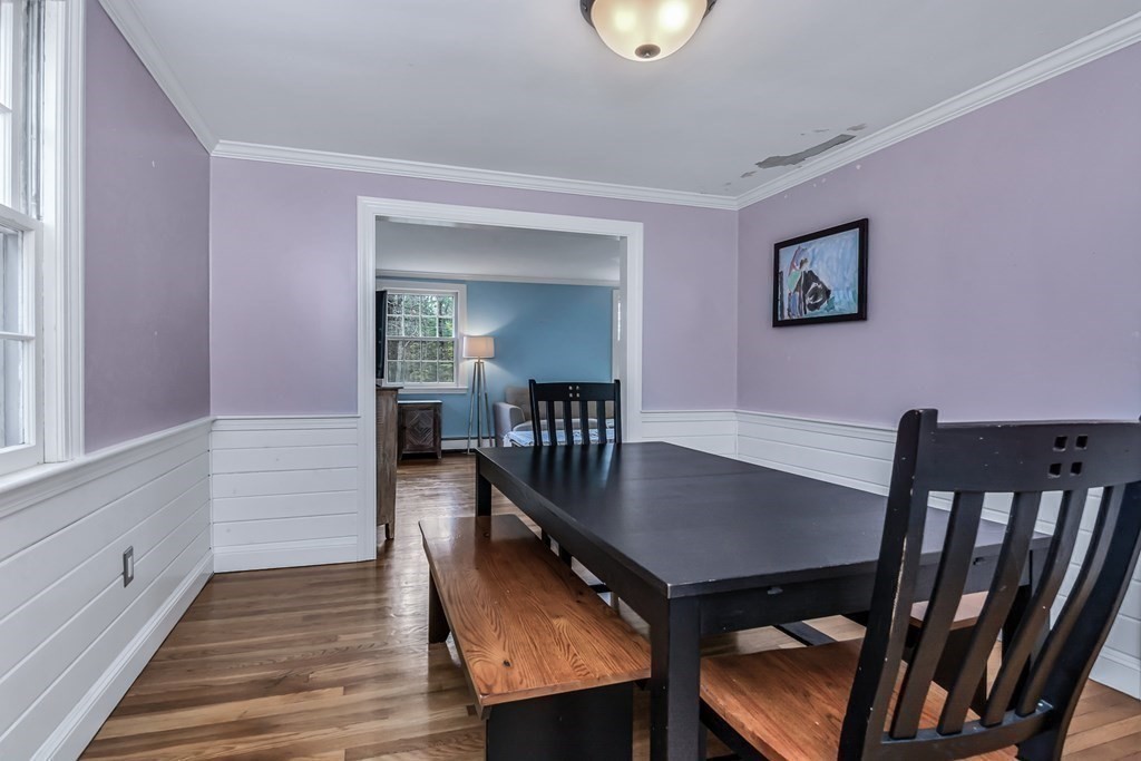 21 Stage Coach Road Boxford, MA 01921 - Photo 15 of 40 a view of a dining room with furniture and wooden floor