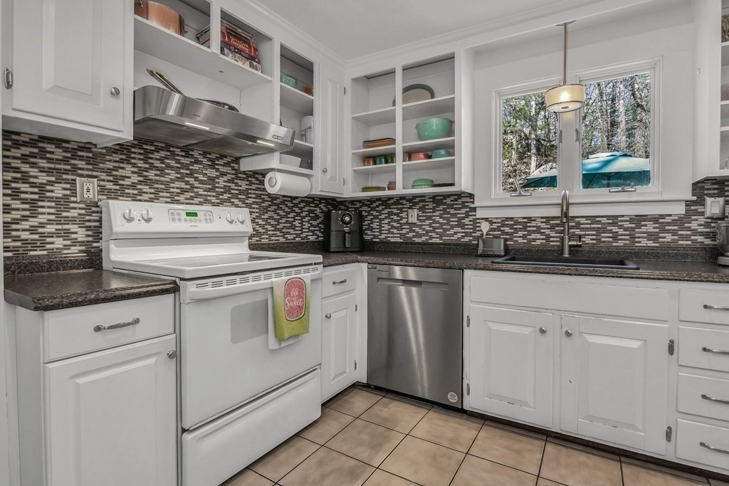 21 Stage Coach Road Boxford, MA 01921 - Photo 21 of 40 a kitchen with white cabinets and white appliances