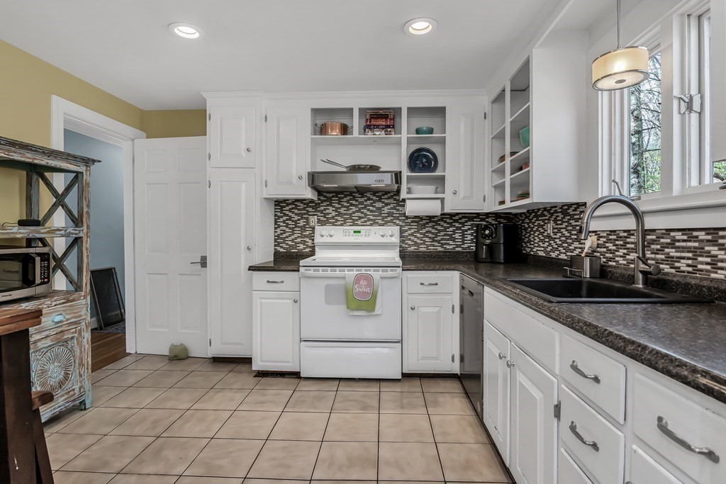 21 Stage Coach Road Boxford, MA 01921 - Photo 22 of 40 a kitchen with a stove and white cabinets