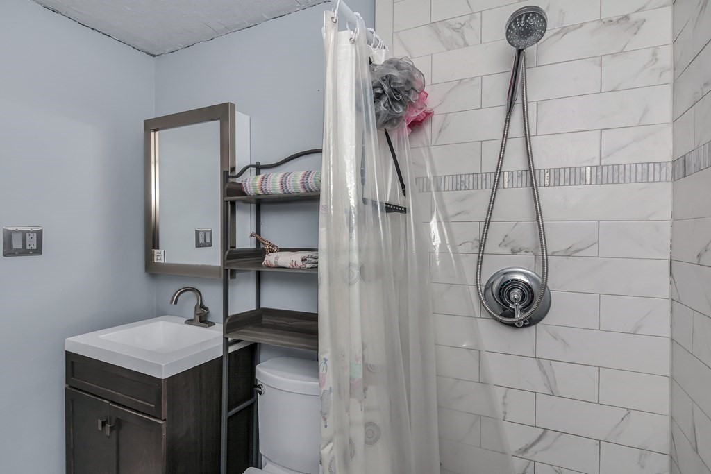 21 Stage Coach Road Boxford, MA 01921 - Photo 25 of 40 a bathroom with a sink vanity and shower