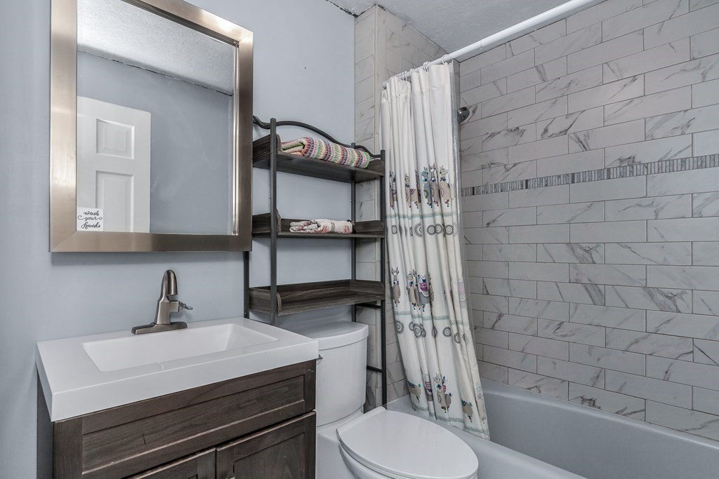 21 Stage Coach Road Boxford, MA 01921 - Photo 26 of 40 a bathroom with a sink a toilet and shower