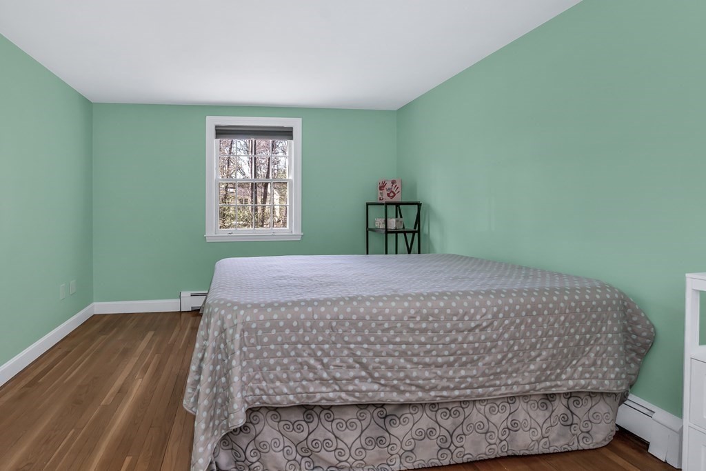 21 Stage Coach Road Boxford, MA 01921 - Photo 34 of 40 a bed sitting in a bedroom next to a window