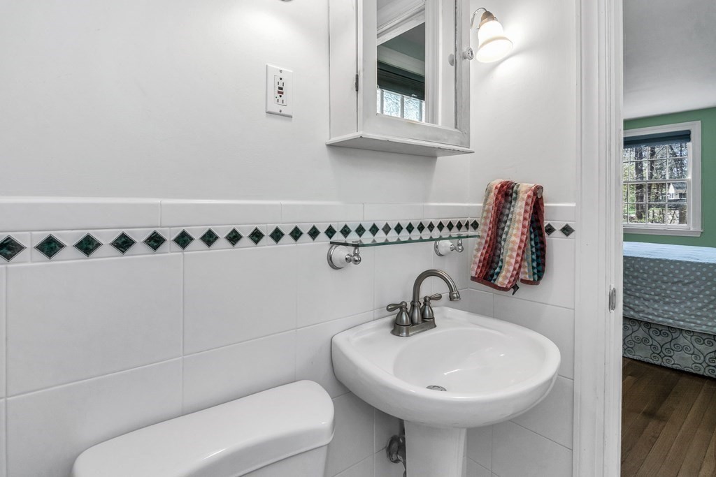 21 Stage Coach Road Boxford, MA 01921 - Photo 36 of 40 a bathroom with a sink and a mirror