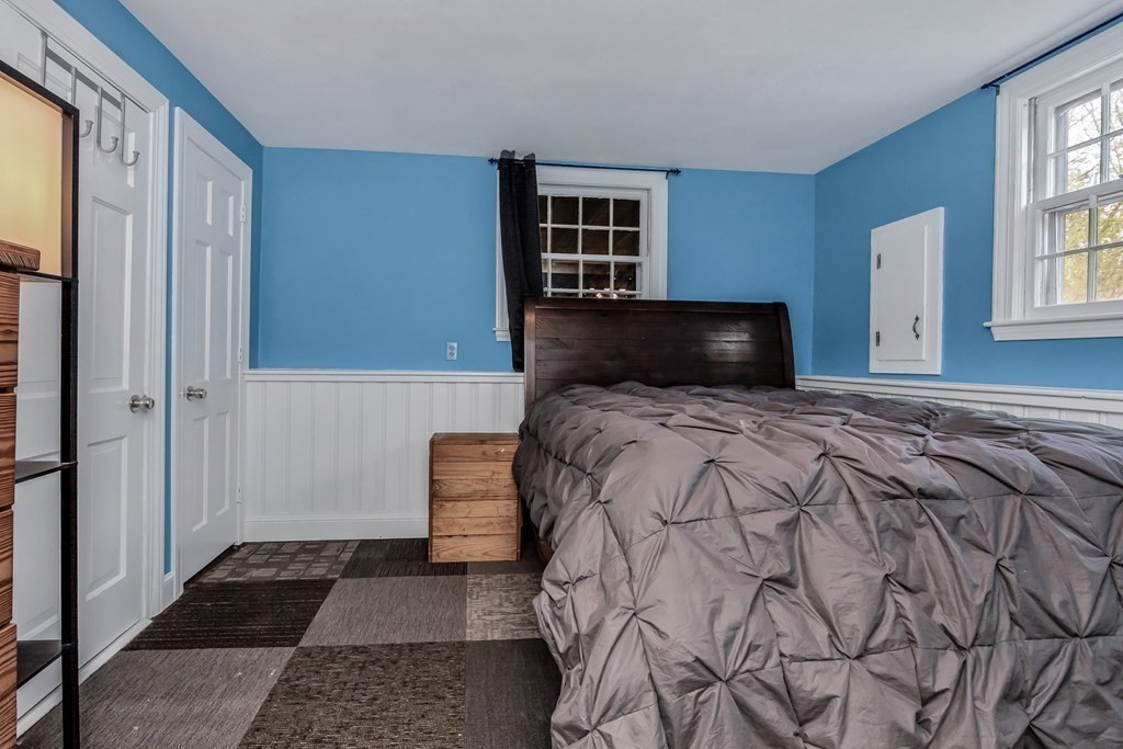 21 Stage Coach Road Boxford, MA 01921 - Photo 37 of 40 a bedroom with a large bed and a window