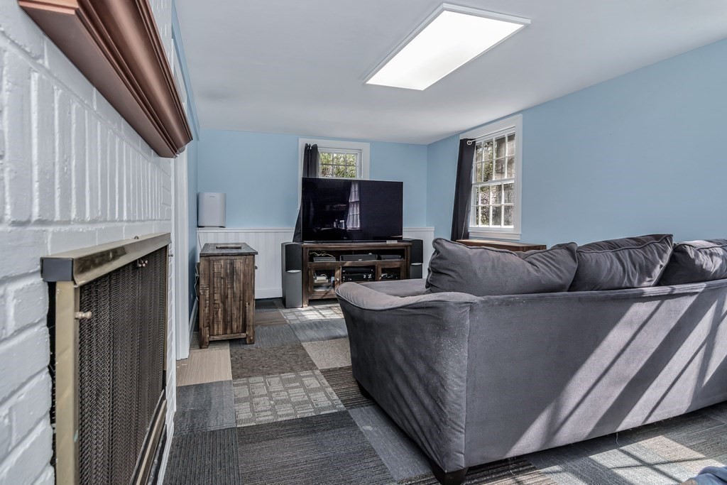 21 Stage Coach Road Boxford, MA 01921 - Photo 38 of 40 a living room with furniture and a flat screen tv