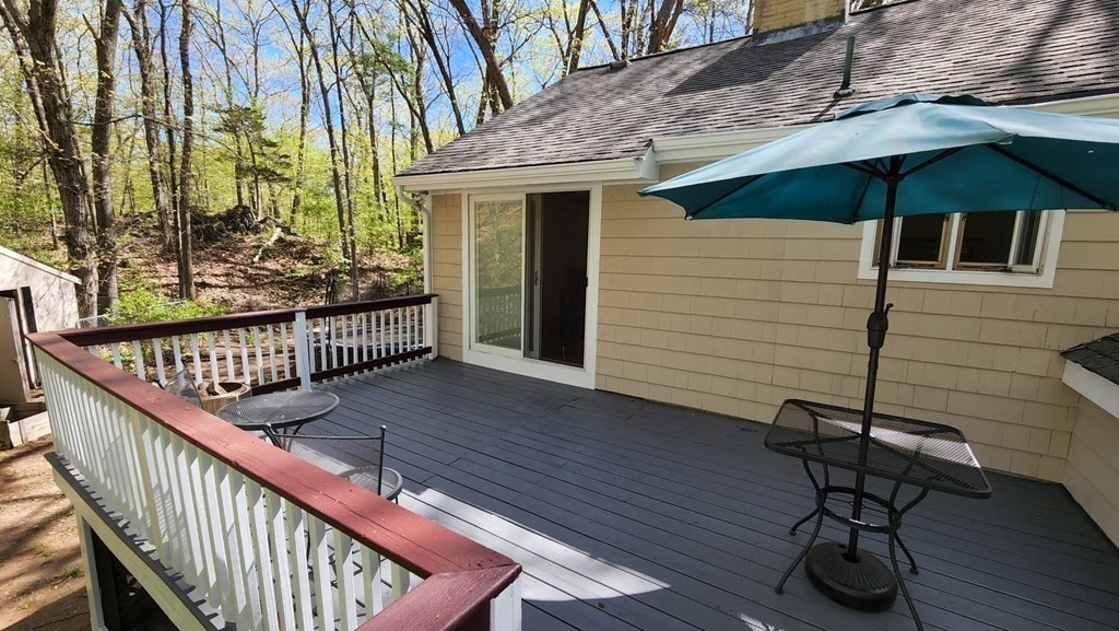 21 Stage Coach Road Boxford, MA 01921 - Photo 5 of 40 a balcony with table and chairs