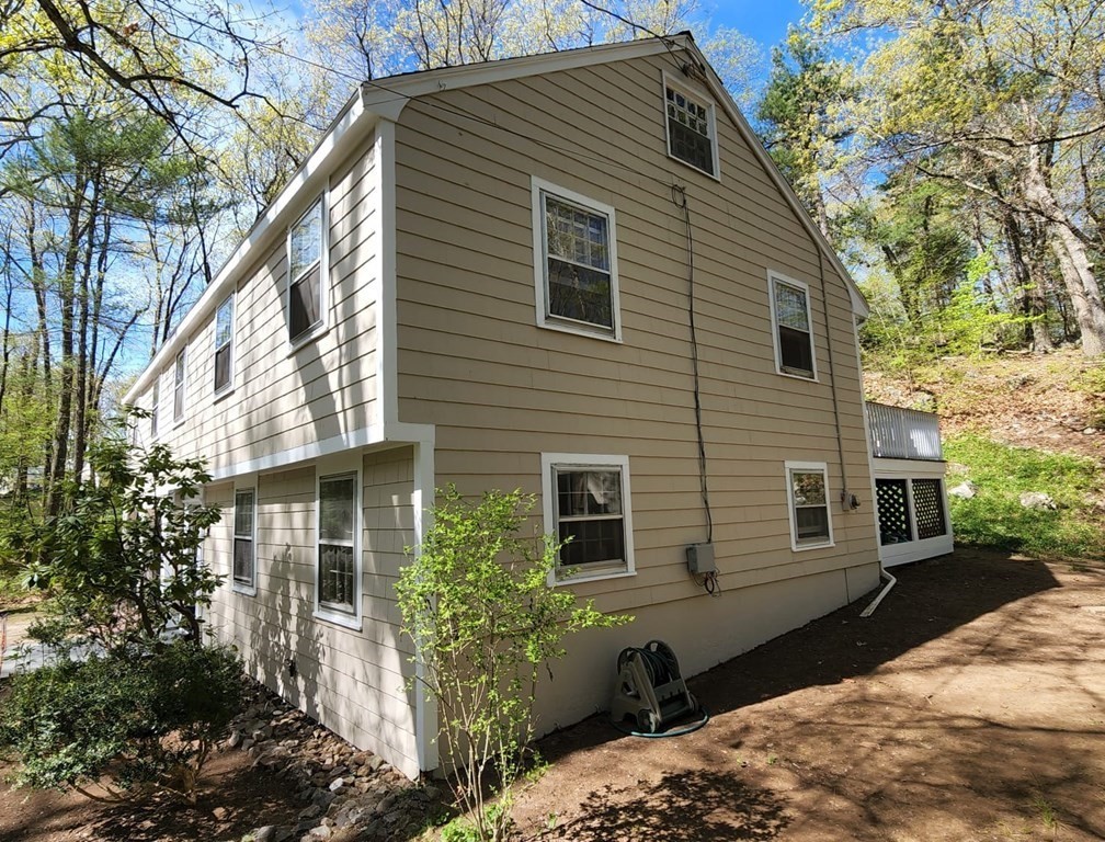 21 Stage Coach Road Boxford, MA 01921 - Photo 7 of 40 a view of a house with a yard