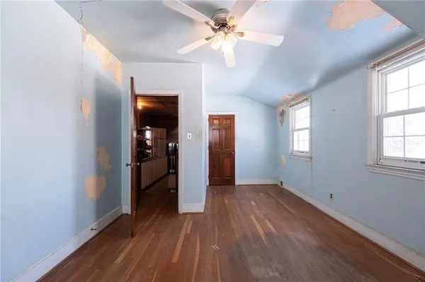 a view of wooden floor in an empty room