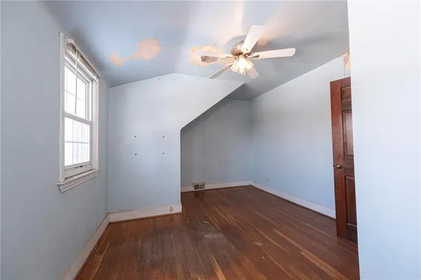 a view of a livingroom with furniture and wooden floor