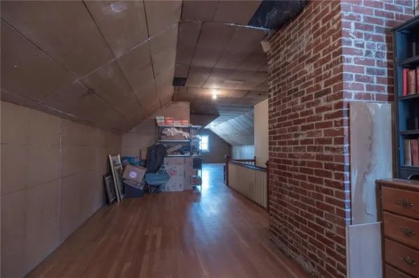 a view of an empty room with a fireplace