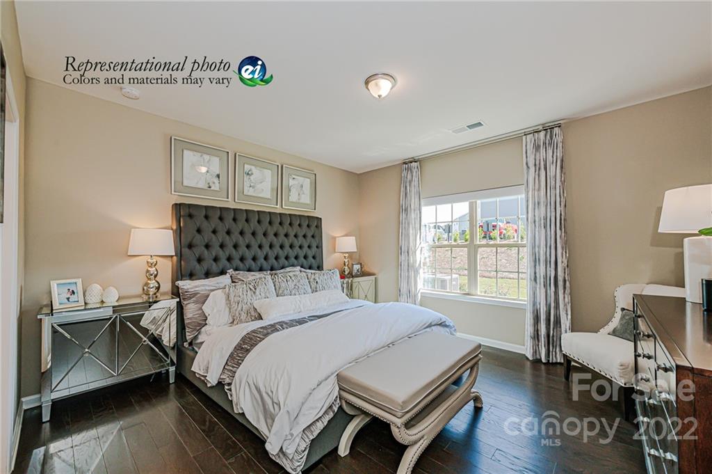 6563 Gopher Road, Unit 350 Lancaster, SC 29720 - Photo 1 of 22 a bedroom with a bed and wooden floor