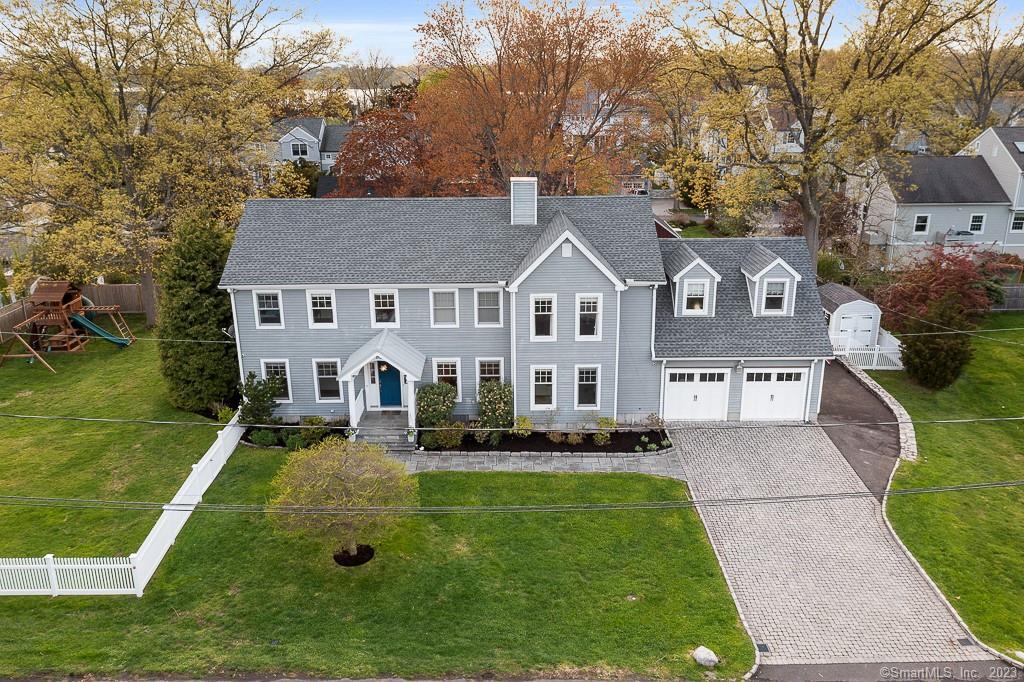 10 Plymouth Road Darien, CT 06820 - Photo 3 of 13 a front view of house with yard and green space