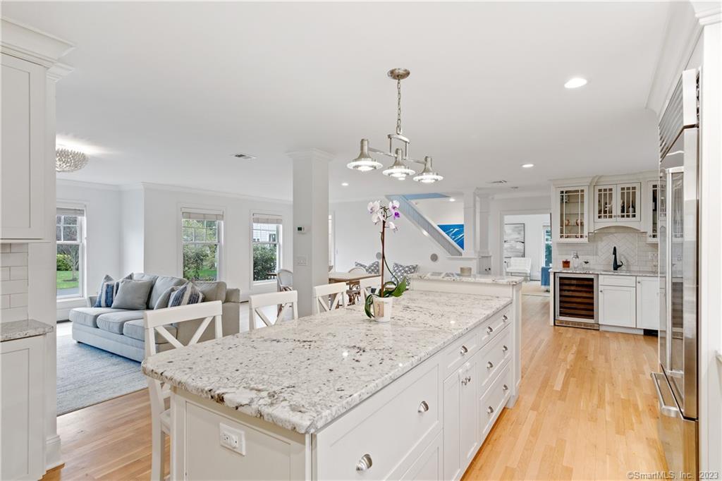 10 Plymouth Road Darien, CT 06820 - Photo 8 of 13 a view of living room with granite countertop furniture and fireplace