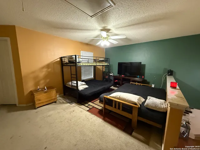 a room with furniture and a flat screen tv
