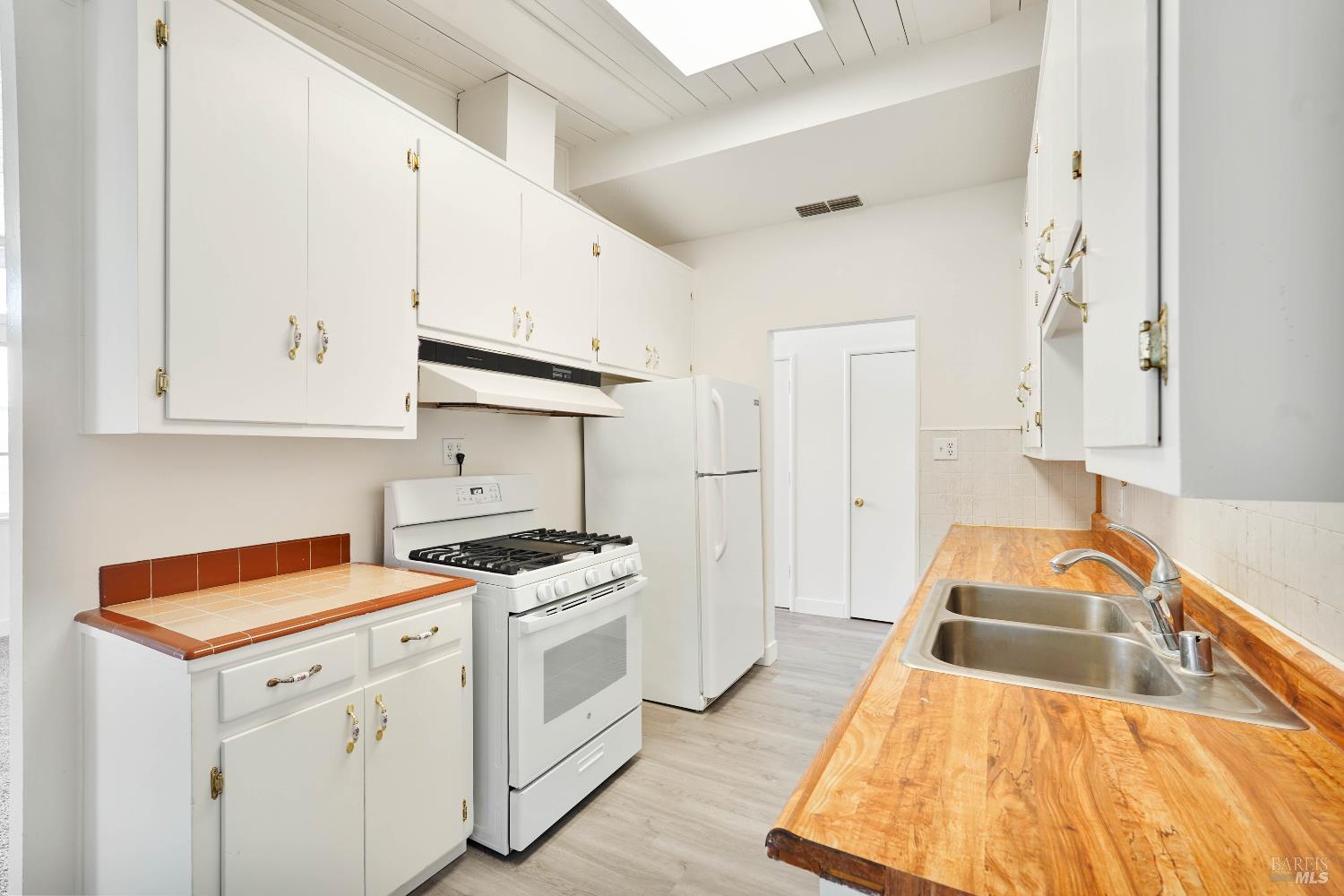 240 South 7th Street Dixon, CA 95620 - Photo 11 of 61 a kitchen that has a sink and a stove