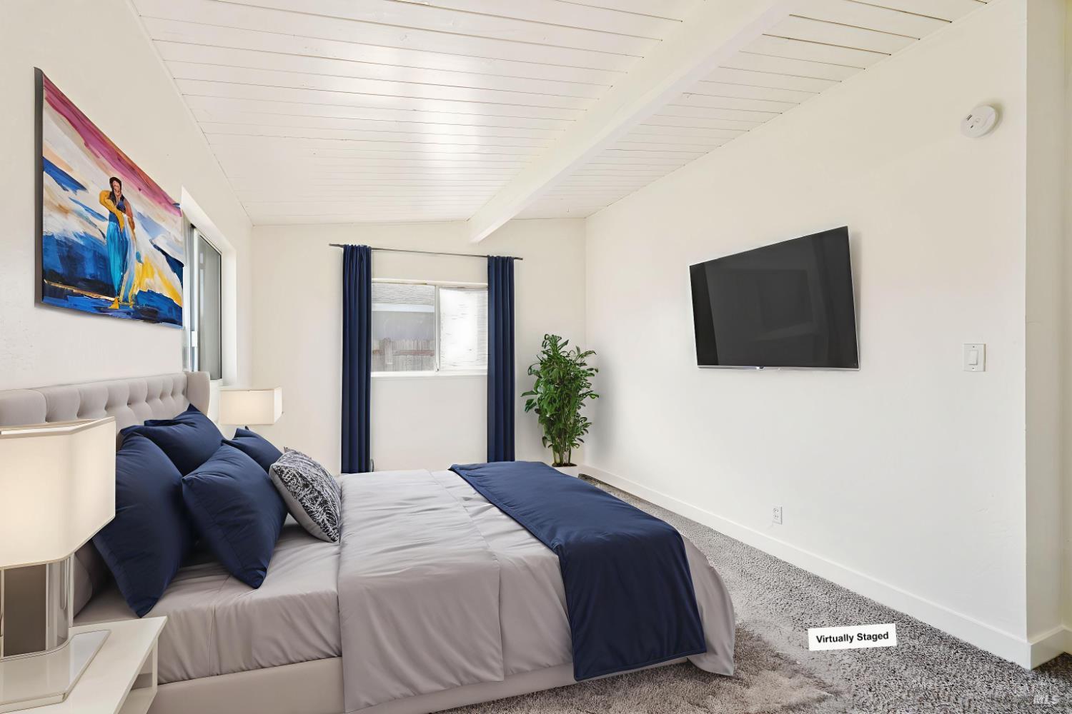 240 South 7th Street Dixon, CA 95620 - Photo 39 of 61 a bedroom with a bed and a flat screen tv