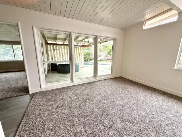 an empty room with windows