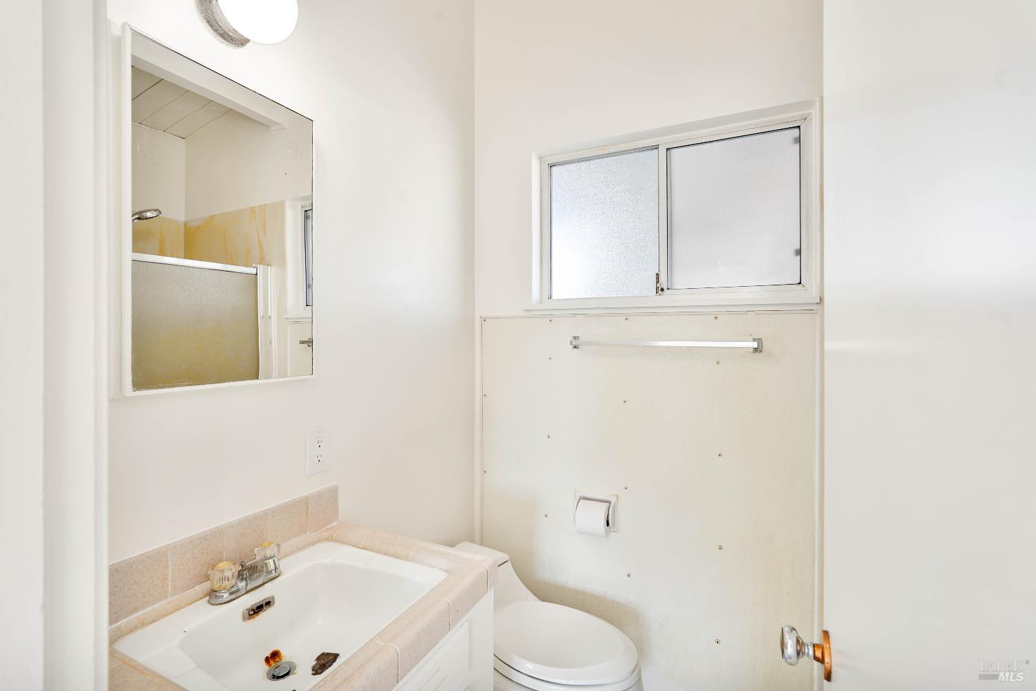 240 South 7th Street Dixon, CA 95620 - Photo 42 of 61 a bathroom with a sink a toilet and shower