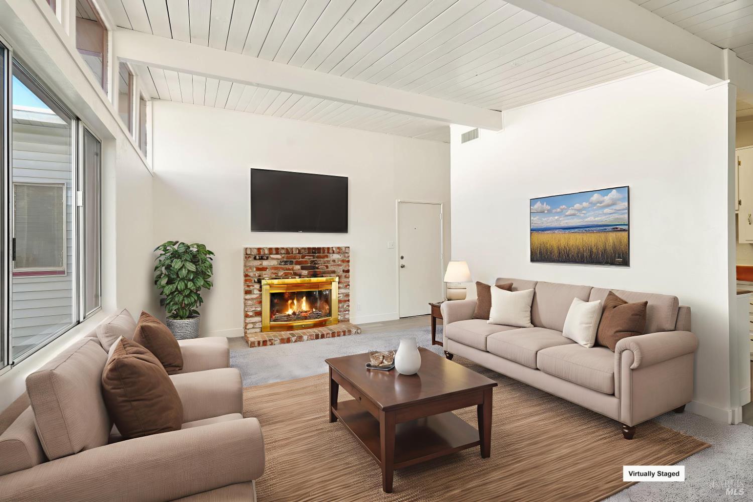 240 South 7th Street Dixon, CA 95620 - Photo 6 of 61 a living room with furniture a flat screen tv and a fireplace