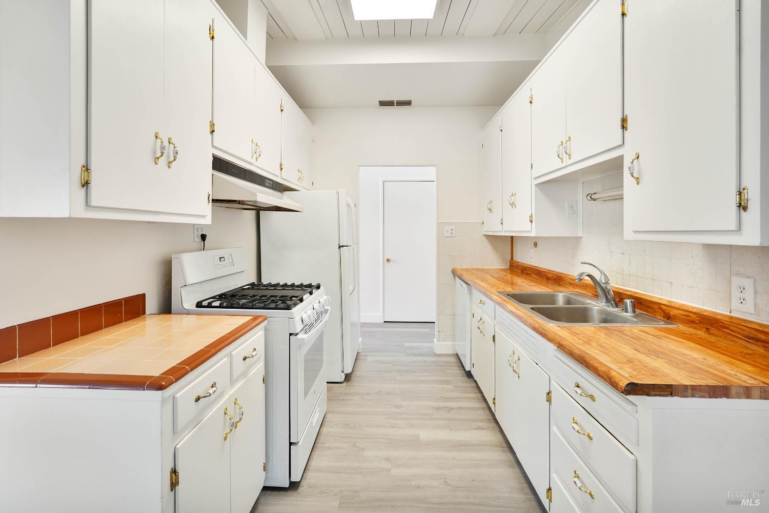 240 South 7th Street Dixon, CA 95620 - Photo 9 of 61 a kitchen with granite countertop a sink and a stove