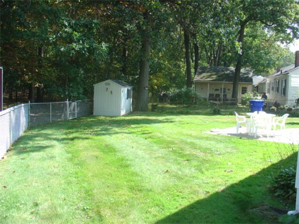 44 Duffy Lane Springfield, MA 01119 - Photo 16 of 16 a view of a backyard with a small cabin