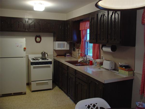 44 Duffy Lane Springfield, MA 01119 - Photo 4 of 16 a kitchen with a sink a stove and refrigerator