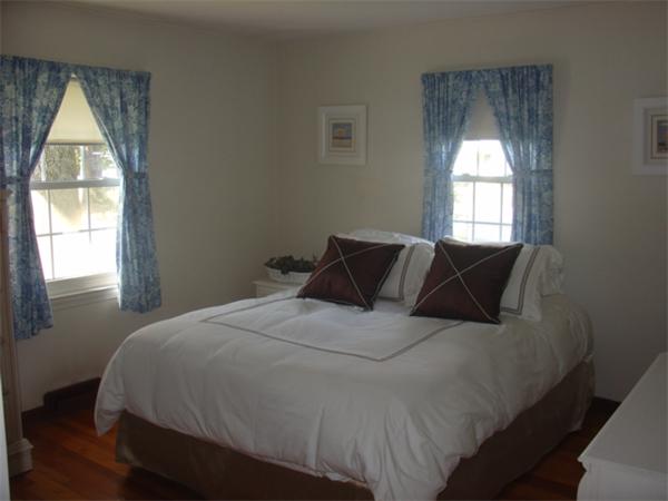 44 Duffy Lane Springfield, MA 01119 - Photo 7 of 16 a bedroom with a bed and a window