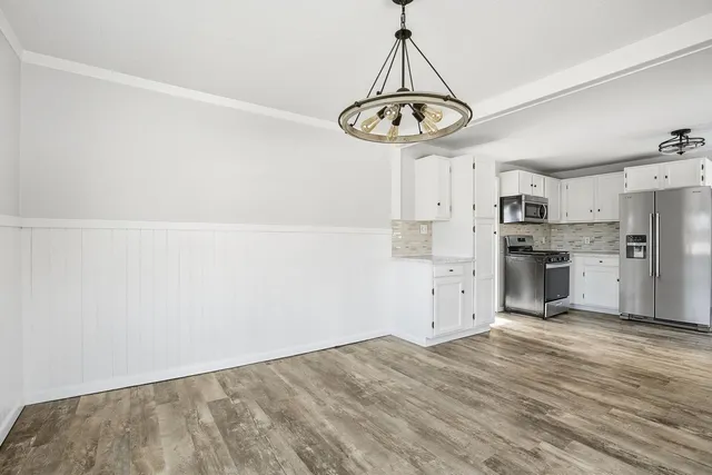 an empty room with fan and a ceiling fan
