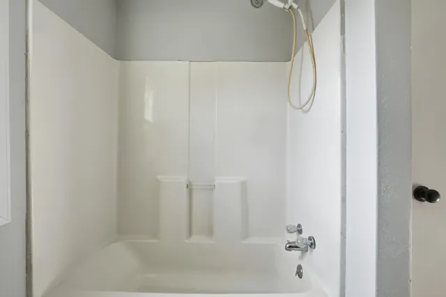 a bathroom with a toilet a sink and a mirror