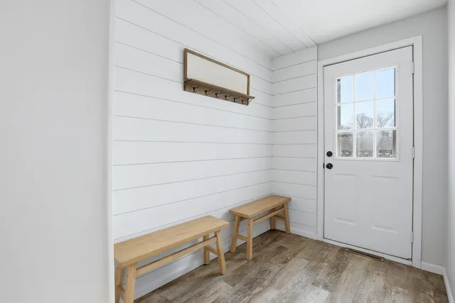 a view of a door and chair in a room