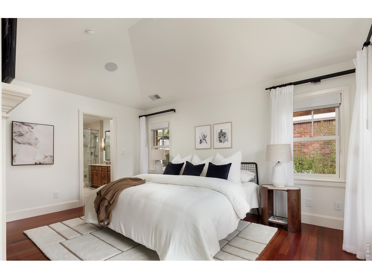 2125 11th Street Boulder, CO 80302 - Photo 23 of 48 a bedroom with a large bed and a window