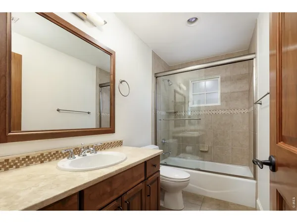 a view of room with cabinet and mirror