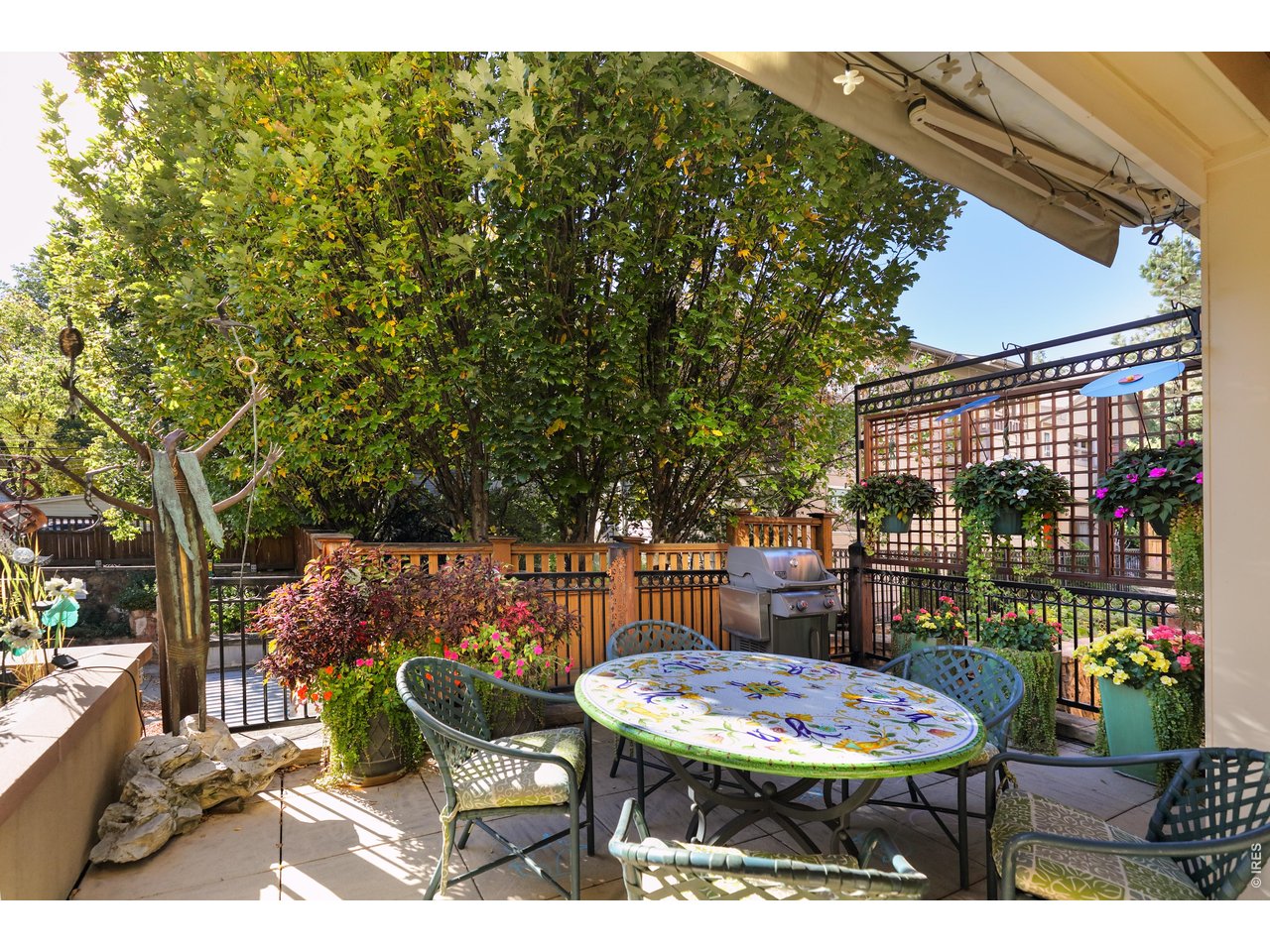 2125 11th Street Boulder, CO 80302 - Photo 41 of 48 a backyard of a house with barbeque oven table and chairs