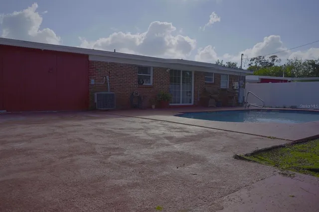 a view of backyard with seating space