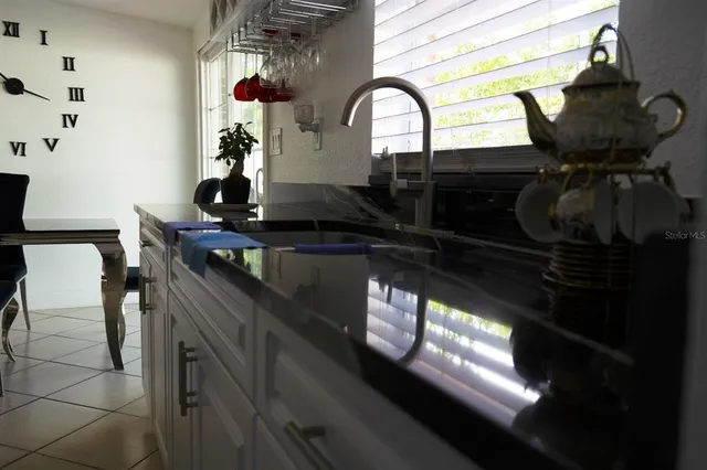 a kitchen with a sink stove and refrigerator