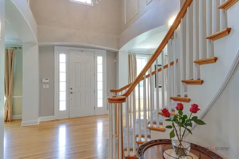 a view of entryway with wooden floor and a potted plant
