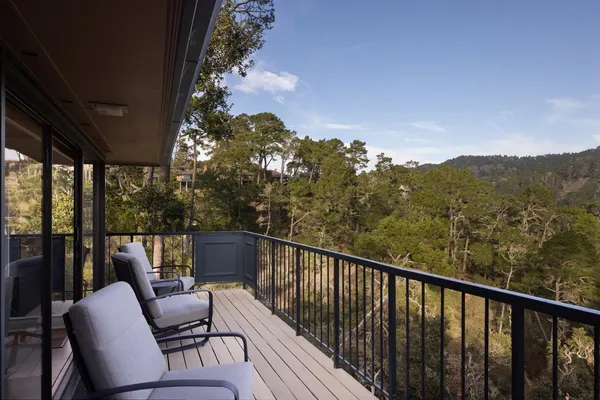 a view of balcony with furniture