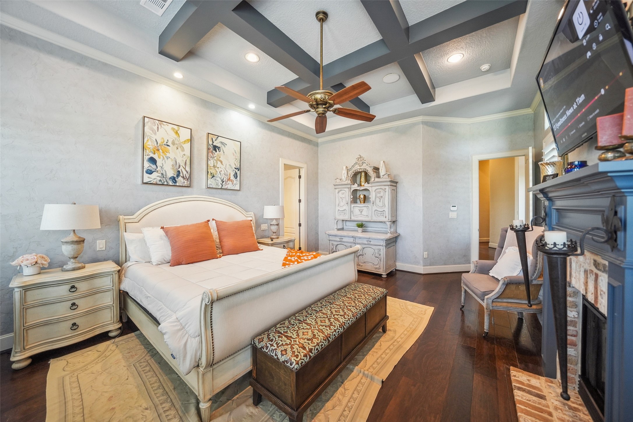 460 Bishop Road Huntsville, TX 77320 - Photo 12 of 50 This elegant suite features a charming fireplace with an antique brick hearth, adding warmth and character to the space. A private door leads to the backyard, while custom plantation shutters provide both style and privacy.