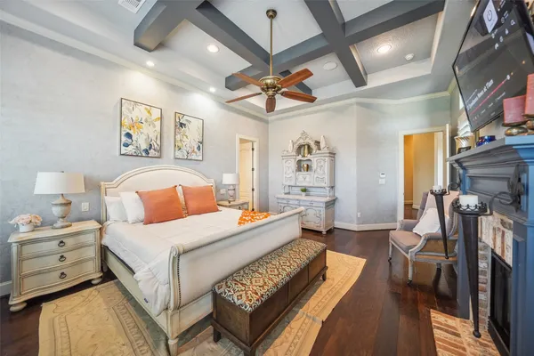 a spacious bedroom with a bed and a couch