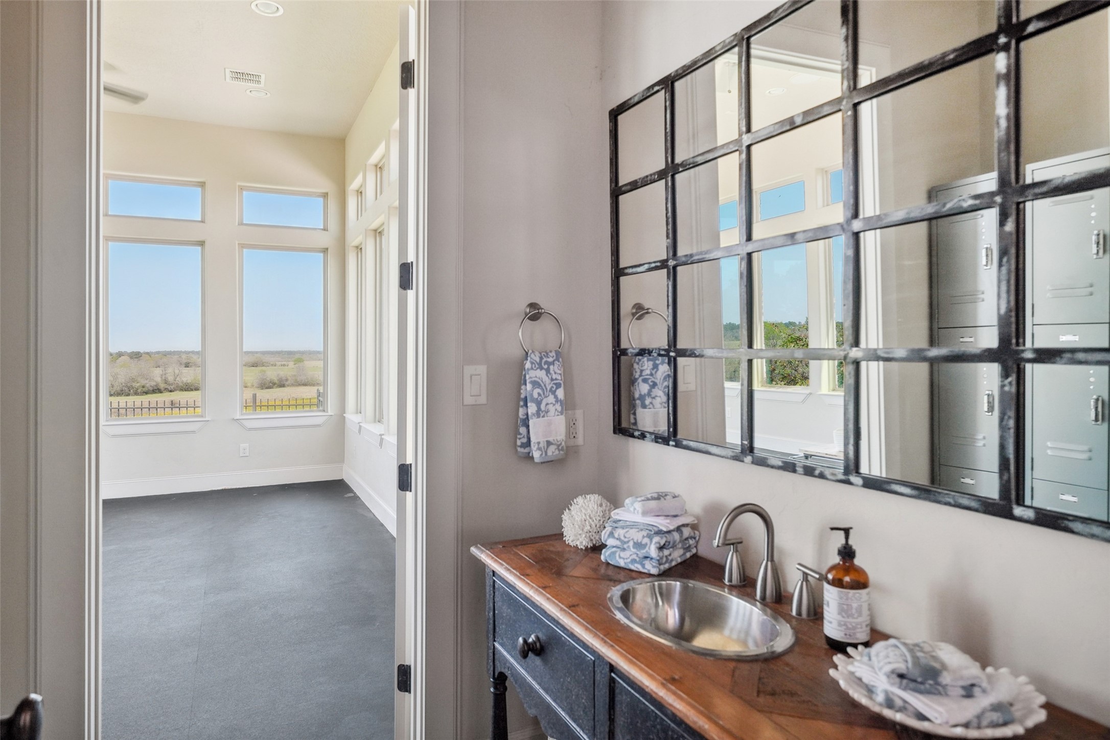 460 Bishop Road Huntsville, TX 77320 - Photo 34 of 50 Built-in lockers provide convenient storage, while a full bathroom with a walk-in shower offers added comfort and functionality.