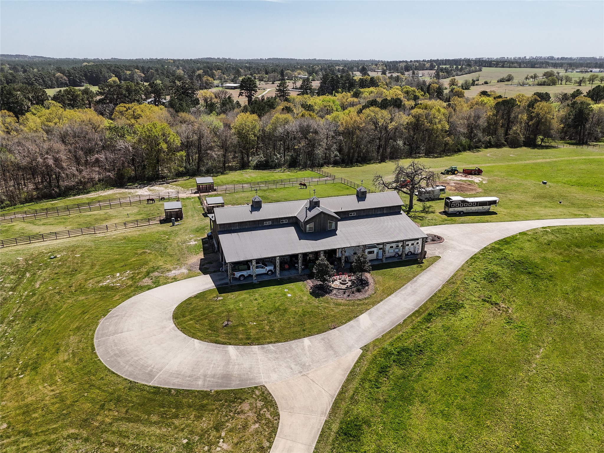 460 Bishop Road Huntsville, TX 77320 - Photo 40 of 50 This exceptional equestrian property features a beautifully designed barn with multiple stalls, spacious paddocks, and covered turnouts.