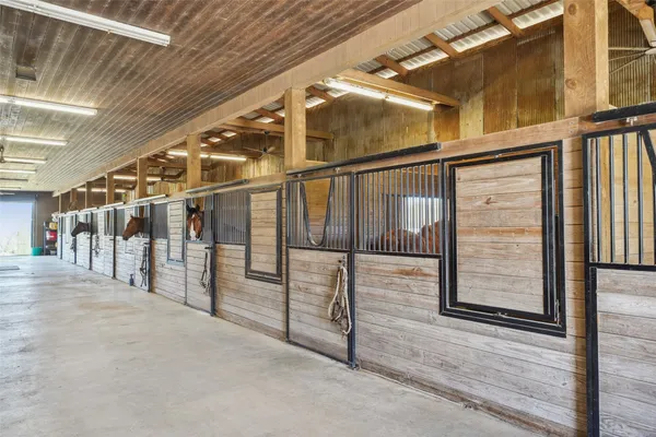 a view of a dining room with furniture a chandelier and wooden floor