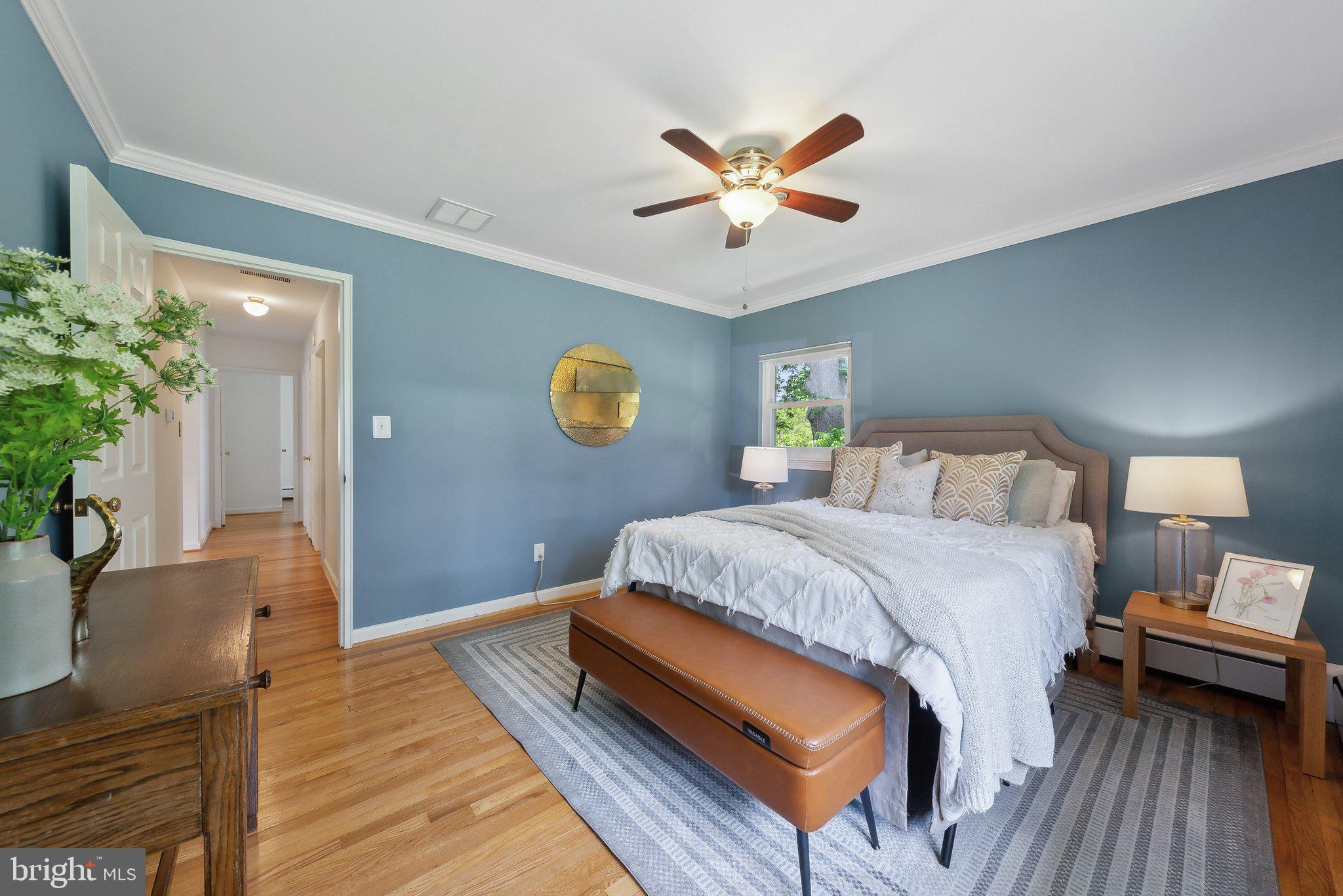 6530 Greenleaf Street Springfield, VA 22150 - Photo 15 of 26 a bedroom with a bed and wooden floor
