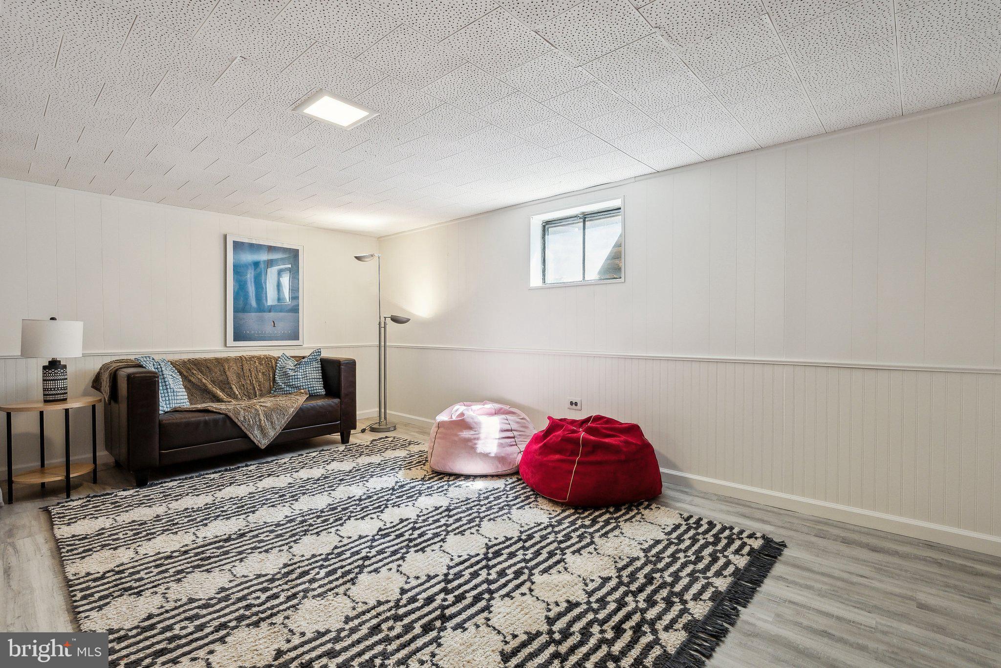6530 Greenleaf Street Springfield, VA 22150 - Photo 23 of 26 a bedroom with a bed and wooden floor