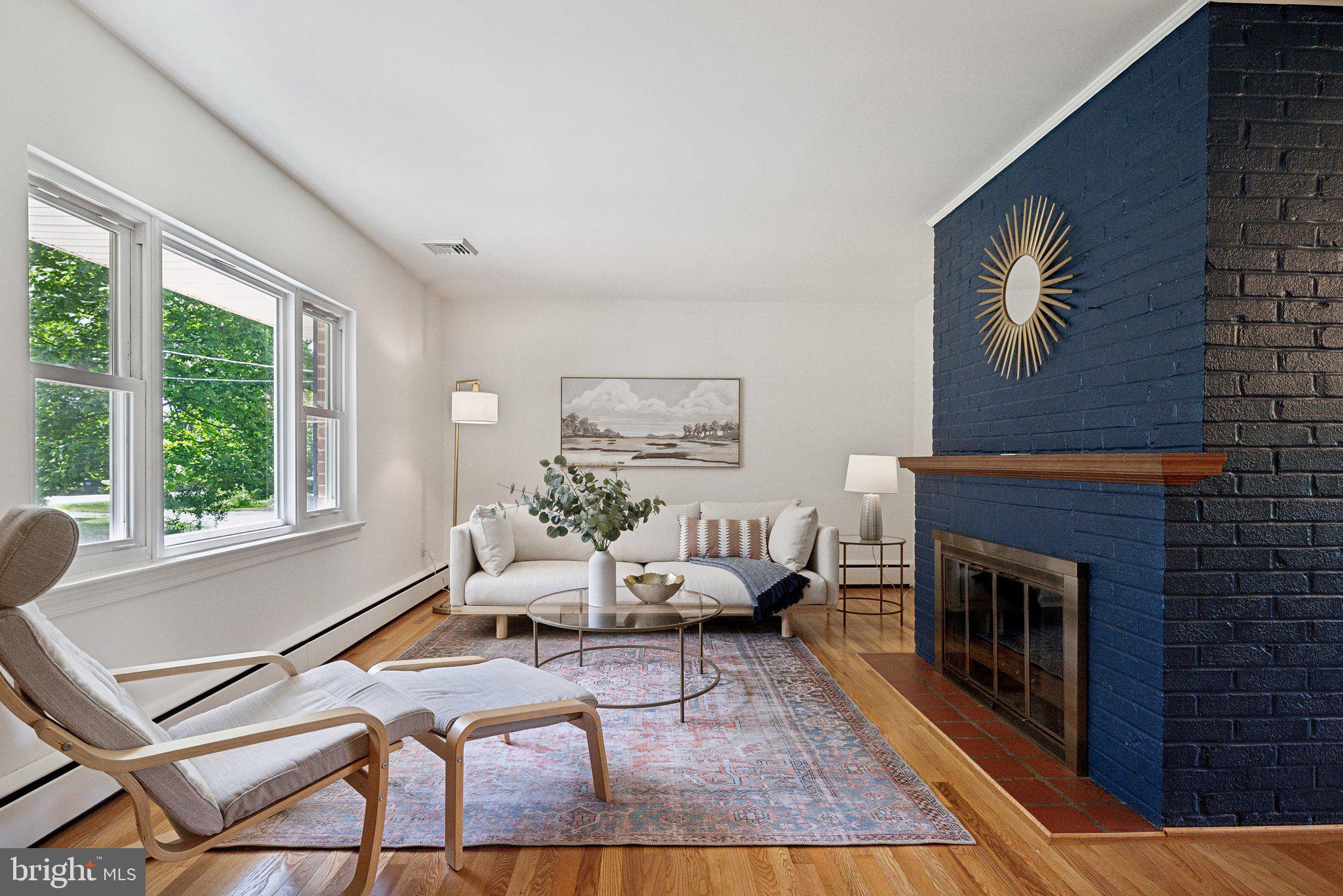 6530 Greenleaf Street Springfield, VA 22150 - Photo 6 of 26 a living room with furniture a fireplace and a large window
