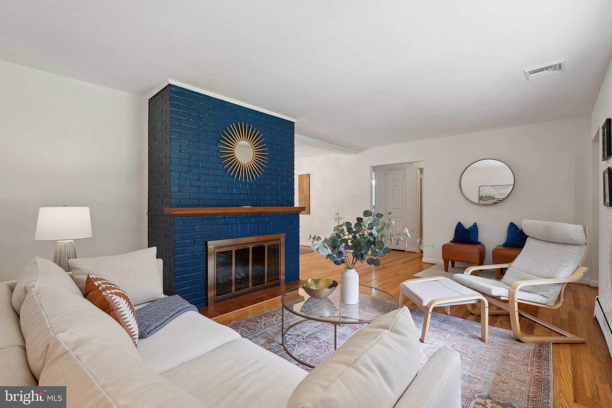 6530 Greenleaf Street Springfield, VA 22150 - Photo 7 of 26 a living room with furniture and a fireplace