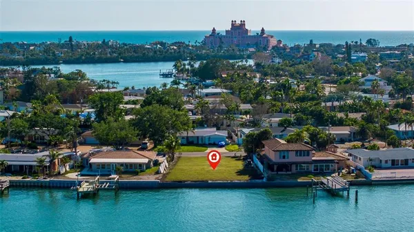 an aerial view of a house with a yard lake view and mountain view