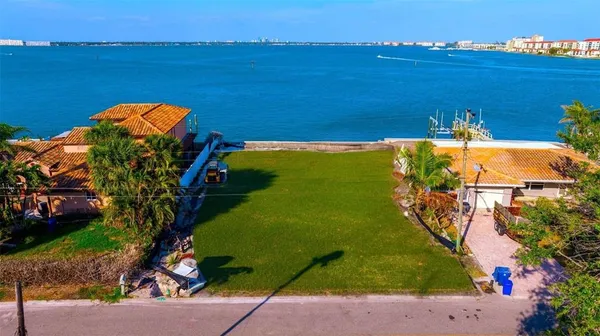 an aerial view of a house with a ocean view